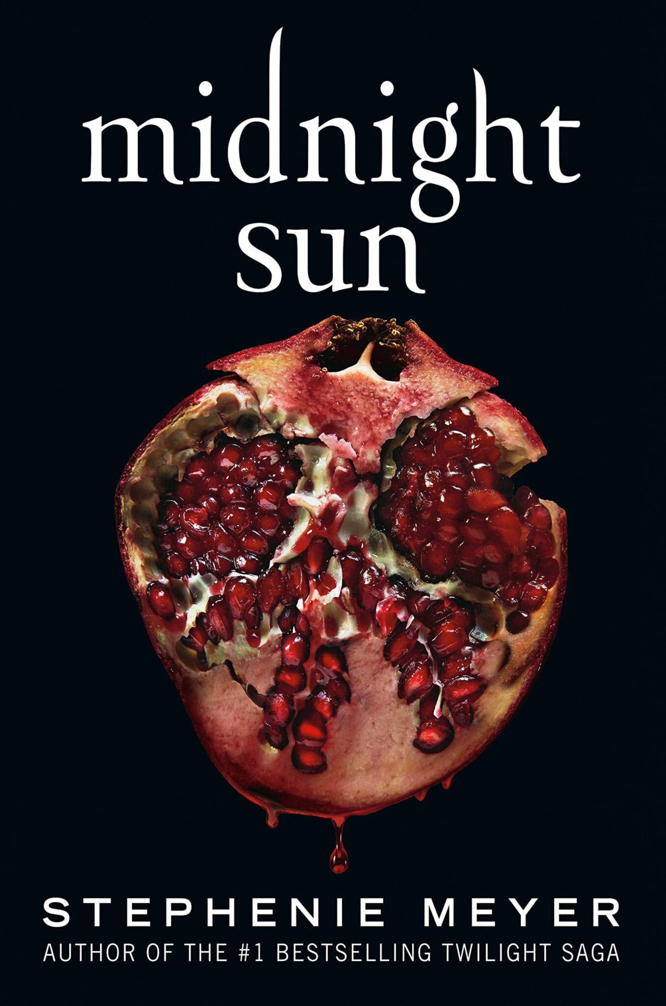 midnight sun book cover of a red pomegranate on a black background